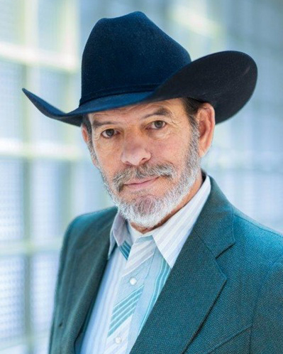 Robert Frobose, wearing a cowboy hat, MID Commissioner of SJTA